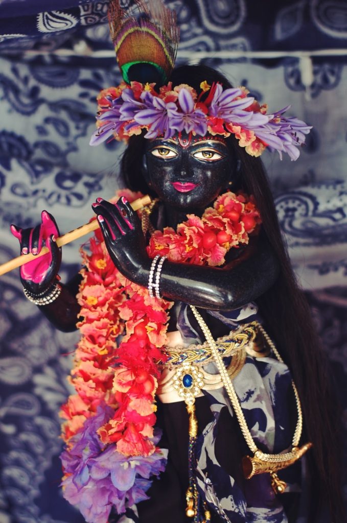 krishna syamasundar deity with red garland, peacock feather black syamasundar marble deity form