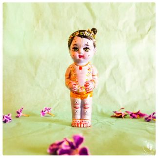 sweet Krishna standing sweetly with garlands of flowers and a little top knot
