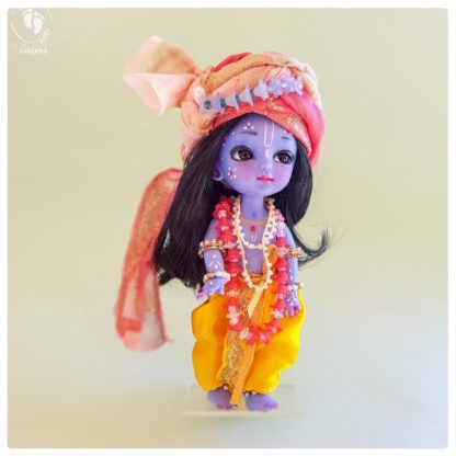 Krishna wears flower garland, special turban