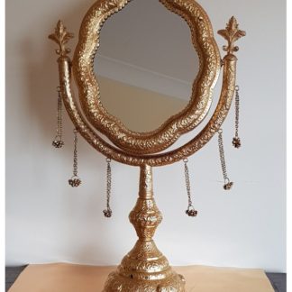 royal gold mirror for deity worship with bell jangles on a stand tilting