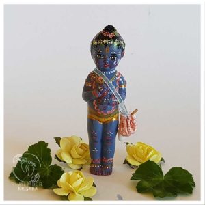Krishna in the forest Vanamali krsna standing with his lunch bag flute and conch on a white background among flowers and dressed with peacock feather and garland