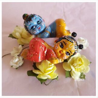 Baby Radha Krishna snuggling