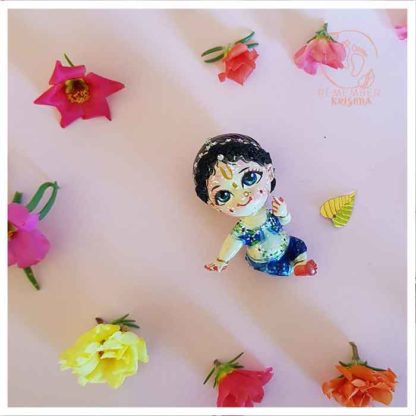 Vishaka gopi doll krsna friend on pink background with blue star ornaments and flower background