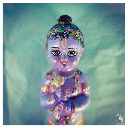 krishna blue skin bun flower garland on blue background sparkline eyes krsna love devotee