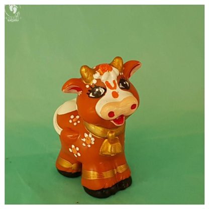 cow brown with ornaments gold horns and friendly long eyelashes krishna's friend cow toy