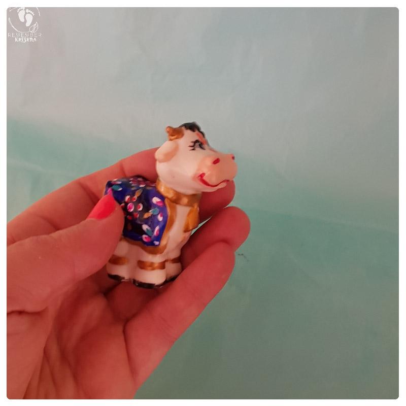 white surabhi cow toy krsna friend