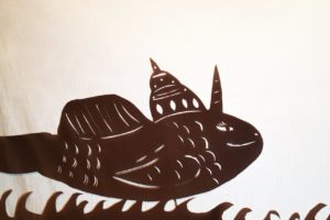 Silhouette Matsya shadow puppet incarnation of sri Krsna in shape of a fish