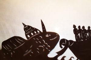 Silhouette Matsya shadow puppet incarnation of sri Krsna in shape of a fish pulling the boat