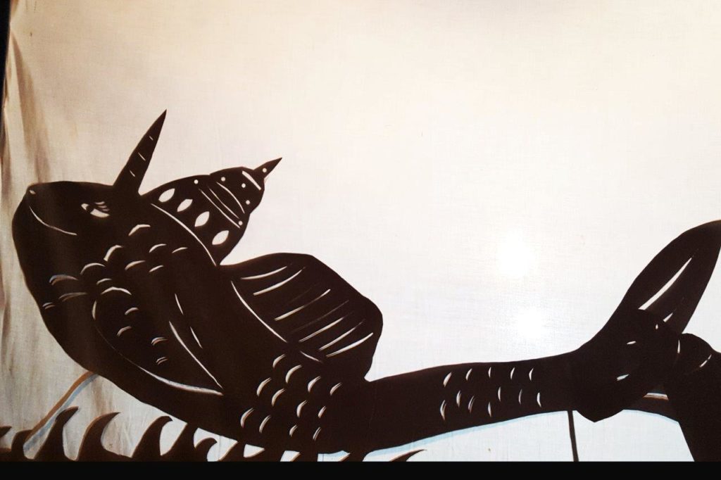Silhouette Matsya shadow puppet incarnation of sri Krsna in shape of a fish 