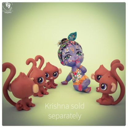 brown monkey baby dolls with curly tails and krishna sitting with the dolls on a green background krishna sold separately text and monkeys have big eyes and poseable heads