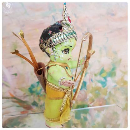 Rama doll for sale lord rama dolls with green skin and golden bow, a golden quiver and a golden arrow strung to rama bow. on a muted peach background. Hindu Vaishnava ramayan interest
