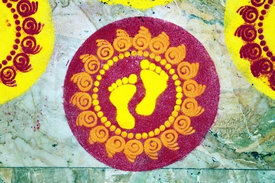 rice flour traditional rangoli decoration stencil on marble floor colorful yellow magento and green marble