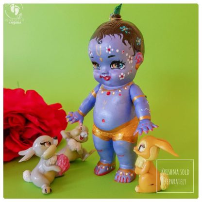 big Krishna doll with bunny rabbit trio
