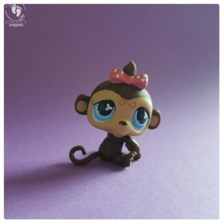 Sweet baby monkey with bow