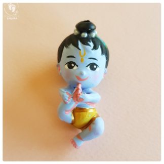 bala Gopal minature Krishna doll playing with his feet