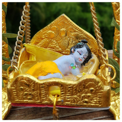 baby Krishna doll in jula snuggling sweetly gollu doll