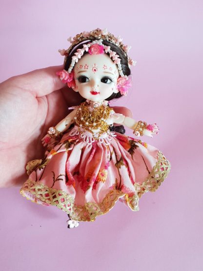 Shri Radha doll with gorgeous braids and flower crown poseable radha doll held in hand