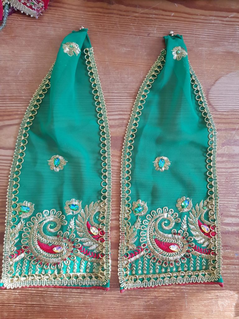 emerald green shawl solution for a dressed Krishna diety. does up with magnetic clasps