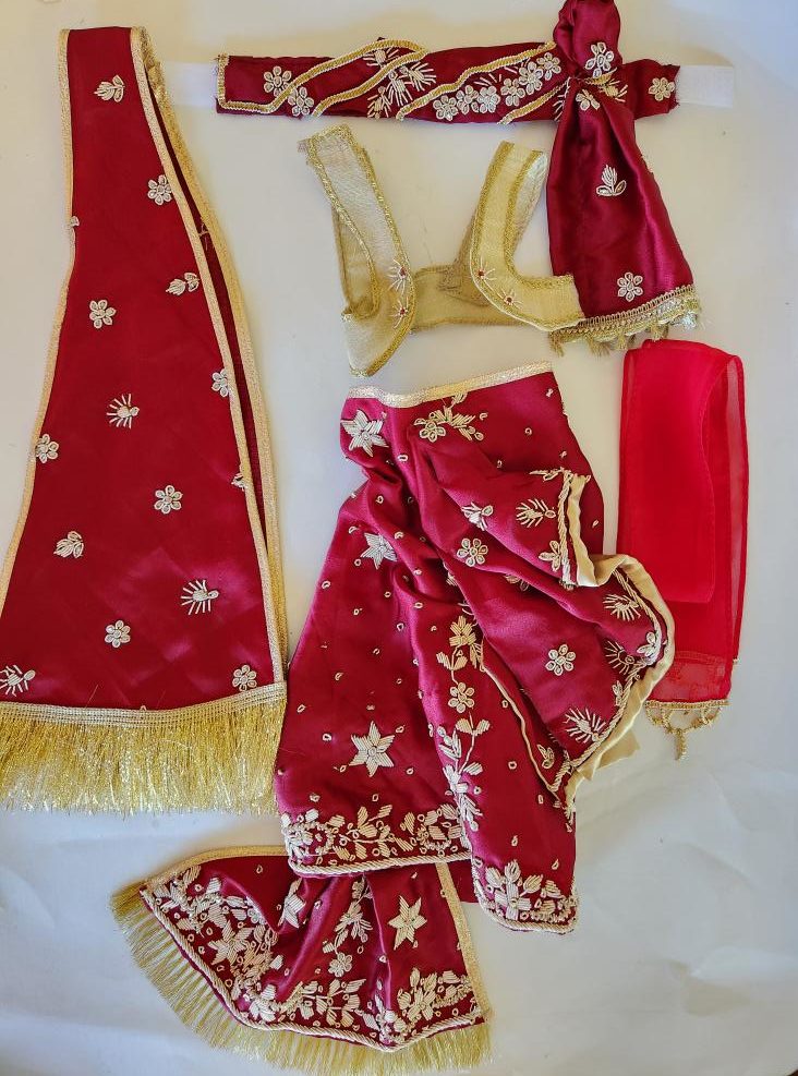 burgandy and gold deity clothes flatlay with turban, shawl, vest, dhoti and pleated waterfall.