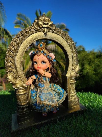 radha doll poseable ball jointed doll for Sri Radha posed against a golden arch and forest backdrop