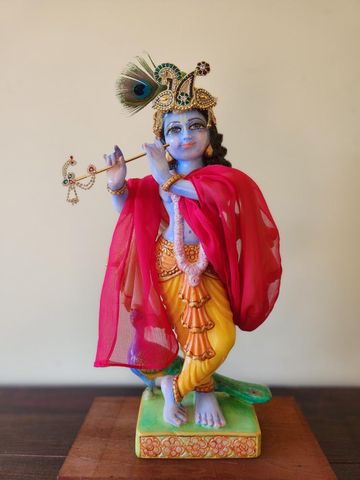 krishna deity dressed and wearing a special crown