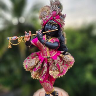 Radha Damodar deity wears gorgeous pink shringar flared skirt. Pink pants and gold embroidery and an opulent pink turban with flowers jewels and cascading details