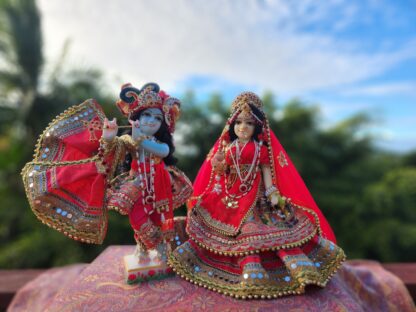 Radha deity wearing shadi colored red shringar carved from marble 12 inch deity with full opulent shringar radha festival deity wearing red Krishna deity dressed for wedding