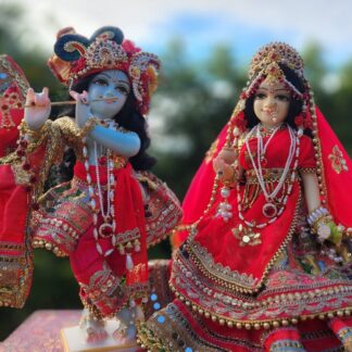 Radha deity wearing shadi colored red shringar carved from marble 12 inch deity with full opulent shringar radha festival deity wearing red Krishna deity dressed for wedding