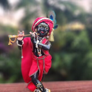 black krishna deity carved marble 10 inch tall murti wearing red shringar