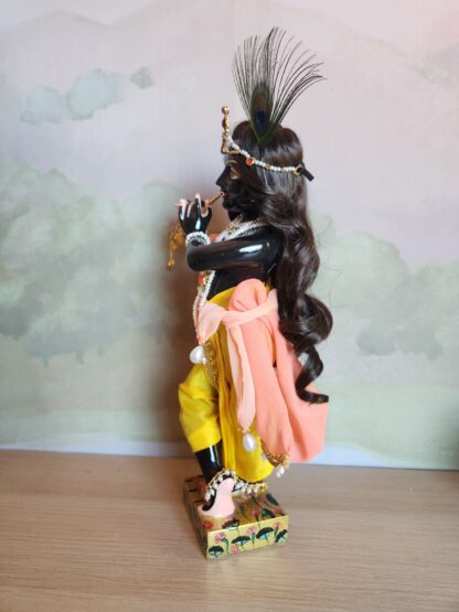 Black Marble Krishna deity side view playing flute dressed in full shringar