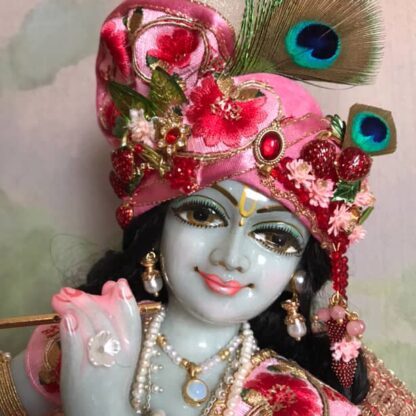 murari Krishna deity hand carved marble with delicate grey tinged complexion wearing pink shringar and playing flute