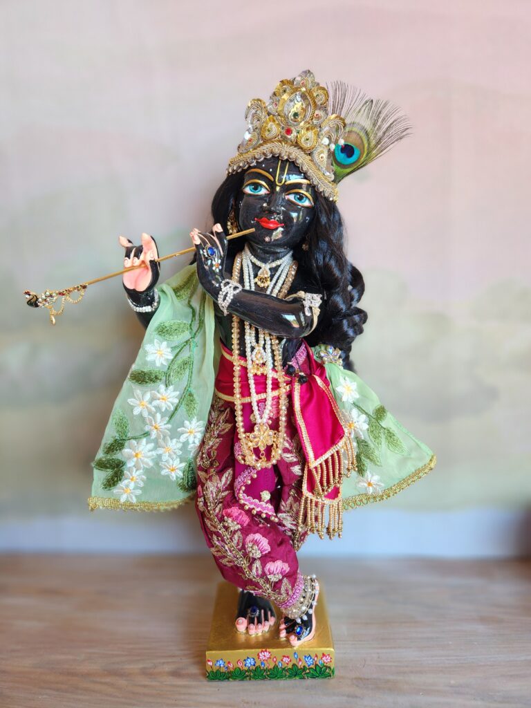 Vigraha Sri Krishna black marble Syamasundar dressed in flowery outfit