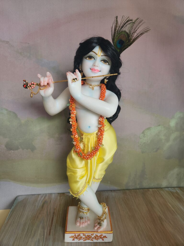 18inch deity of Krishna shown wearing the small jewelled flower garland