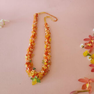 Eternal Marigold jewelled deity garland for an 18-inch Krishna, featuring a rich saffron and golden gradient of faceted beads.