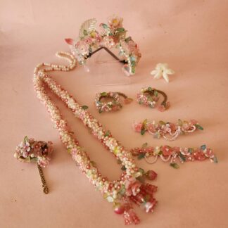 7 piece set of Krishna jewelled flowery floral shringar flatlay for Deity