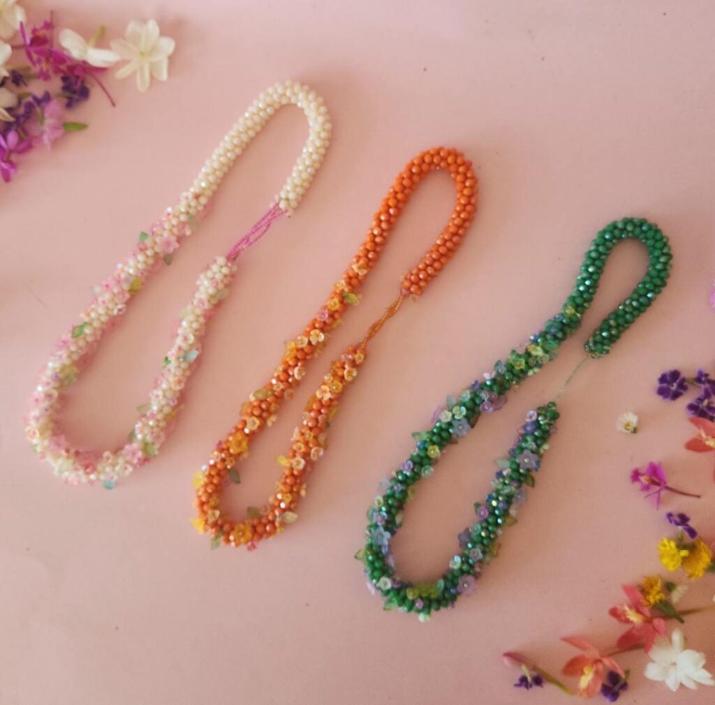 3 styles of jewelled flower garlands beaded with flowers shown is marigold jasmine and green tulsi 