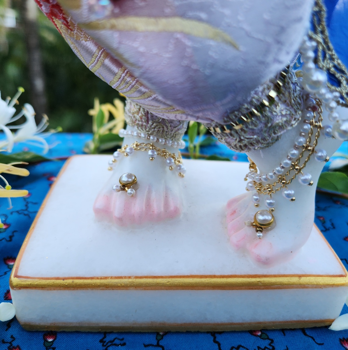 Krishna deity freet decorated with anklebells and jewelled toe rings in pearls