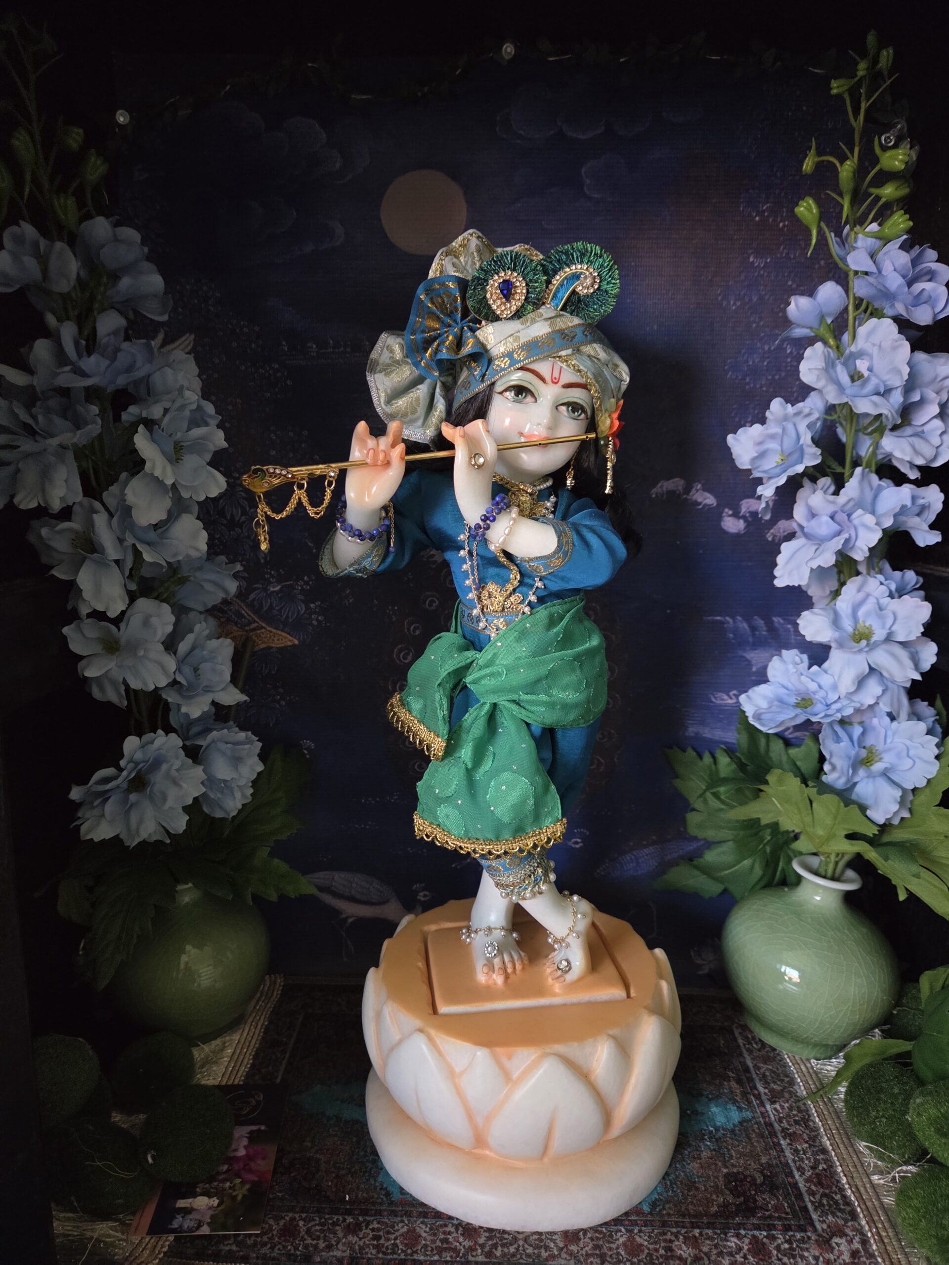 marble deity inserted into marble lotus base