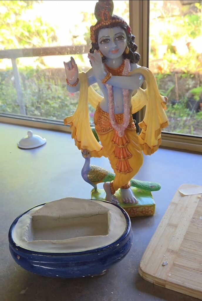 Krishna deity with a special base to stand into - in progress photo